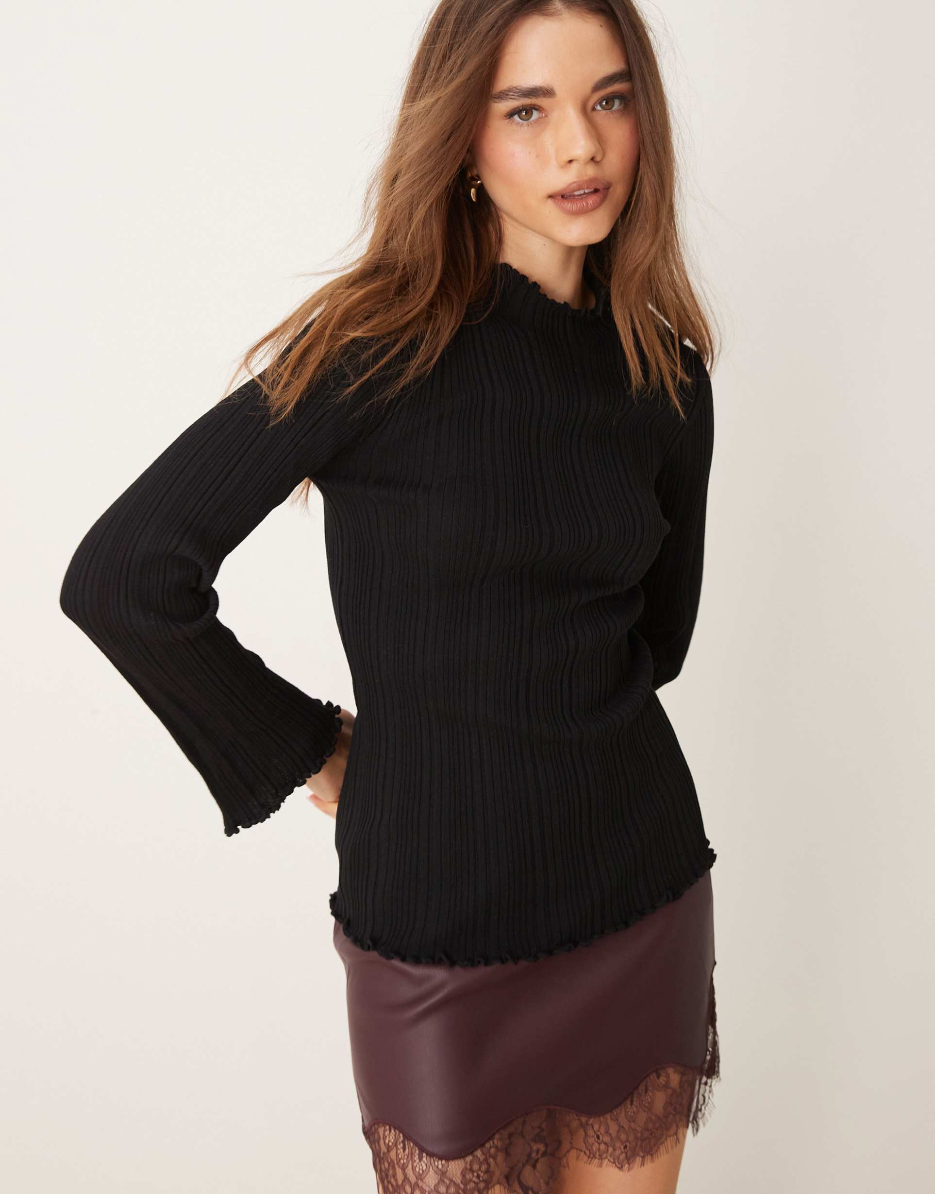 gina tricot long sleeve ribbed knit top with fluted funnel neck and cuffs in black