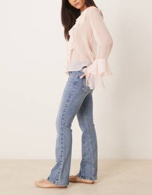GINA TRICOT LOW RISE FLARE LEG JEANS WITH FRONT PANEL DETAIL 