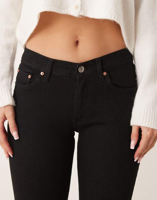 Gina Tricot low rise flare leg stretch jeans in clean black ASOS