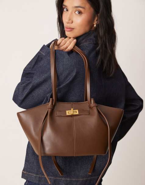 Gina Tricot - Mørkebrun lille tote-taske med strop- og låsdetaljer i imiteret læder - view 1