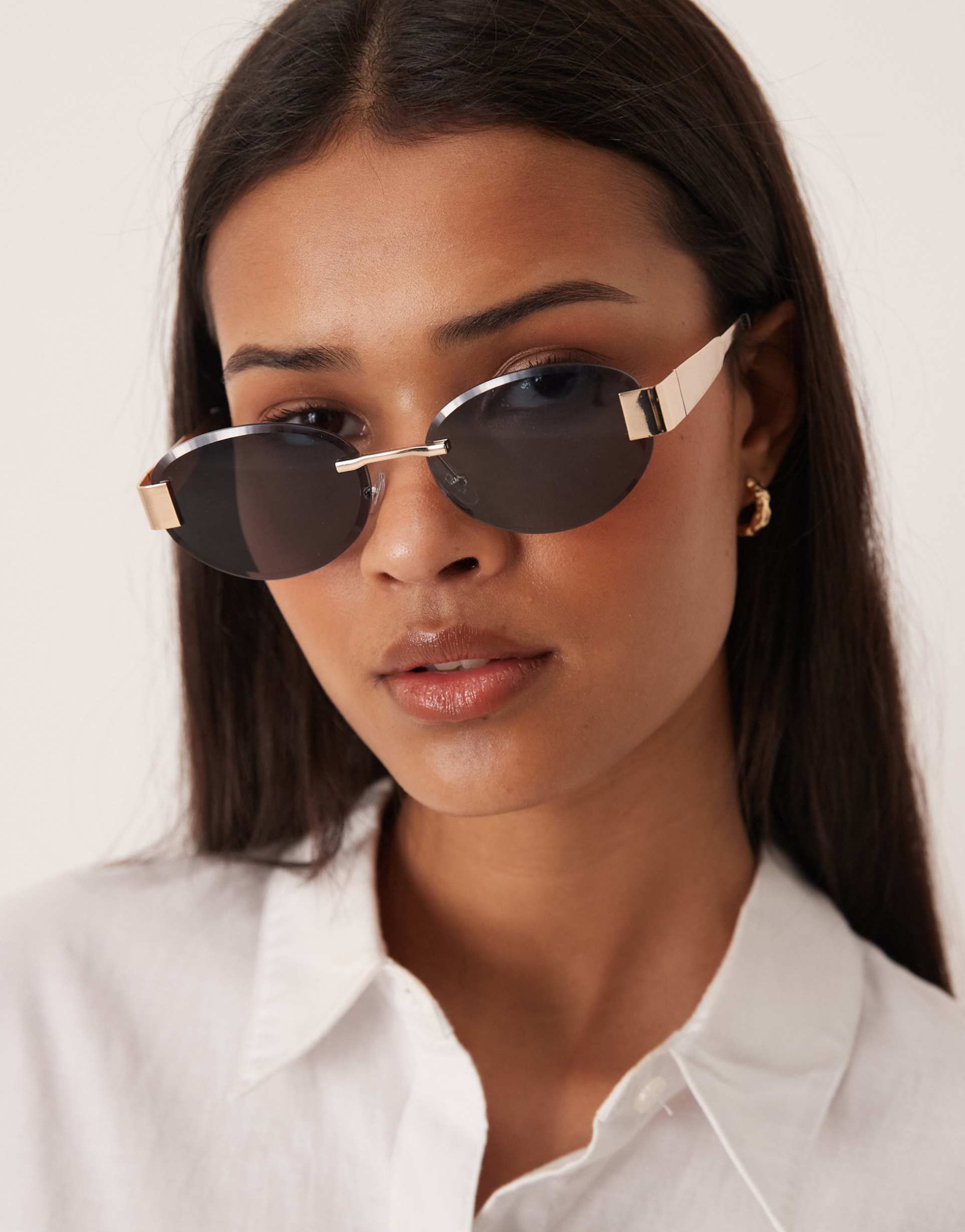 gina tricot rimless sunglasses in black and gold tone