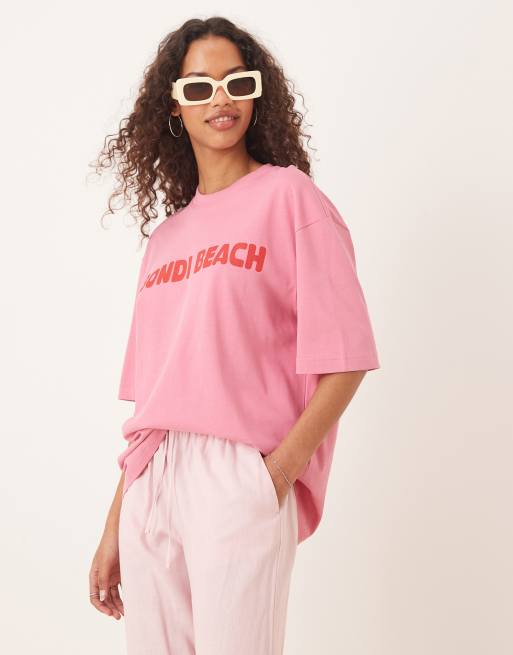 Gina Tricot – Różowy T-shirt oversize z krótkimi rękawami z grafiką „Bondi Beach”