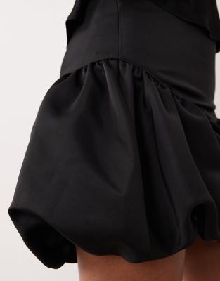 Gina Tricot satin dropped waist balloon mini skirt in black | ASOS