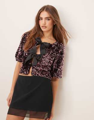 sequin short sleeve top with satin bow front in pink