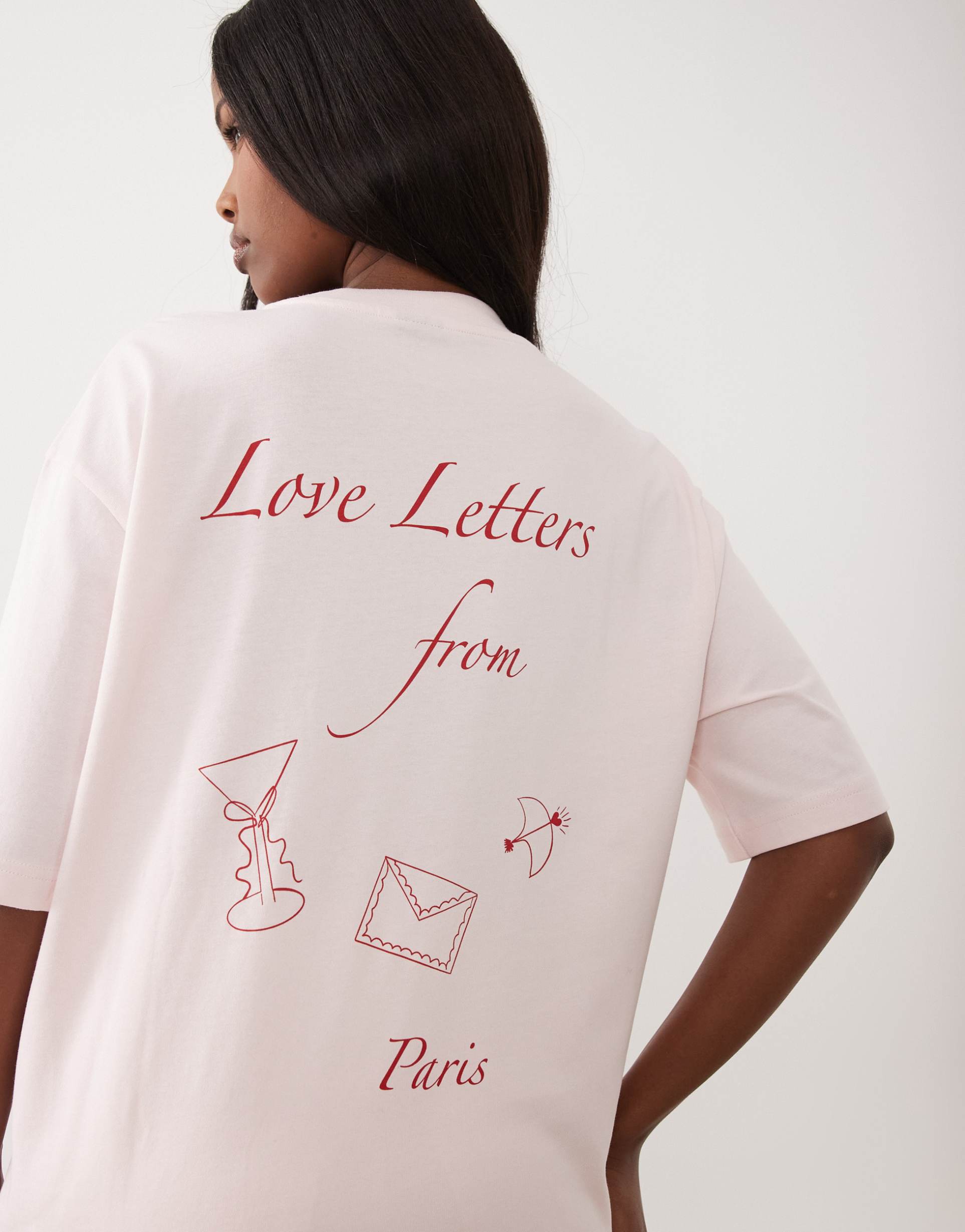 gina tricot short sleeve red 'love letters from paris' printed oversized tee in pink