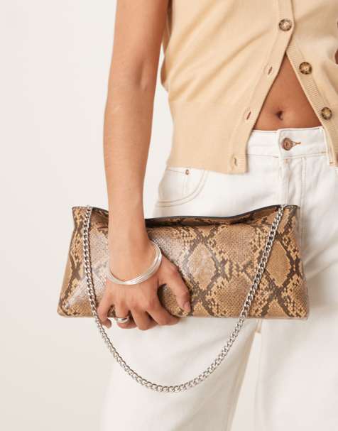 Gina Tricot slouchy clutch bag in snake print - view 1