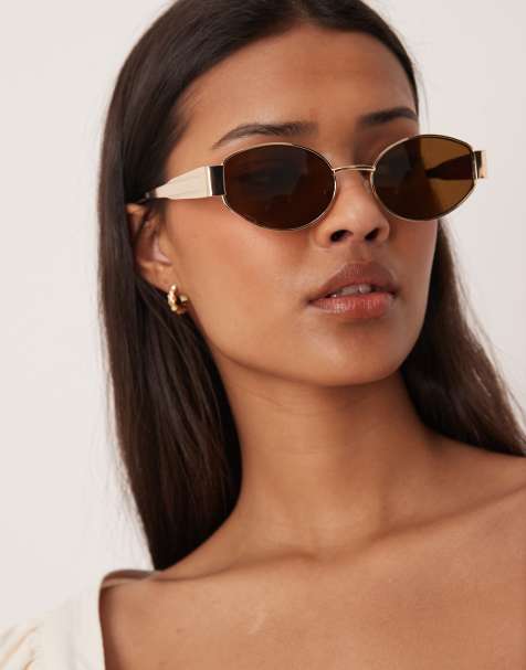 Gina Tricot – Sonnenbrille mit ovalem Metallrahmen in Gold mit braunen Gläsern - view 1
