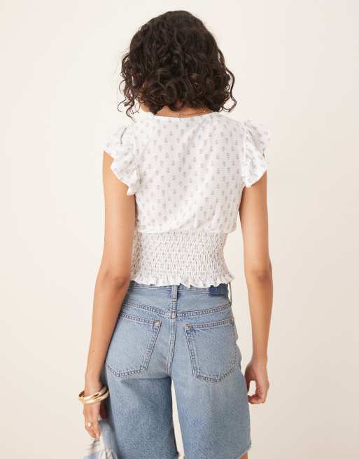 Gina Tricot - Top a maniche corte con stampa bianca e blu con scollo a V e volant, 2 di 4