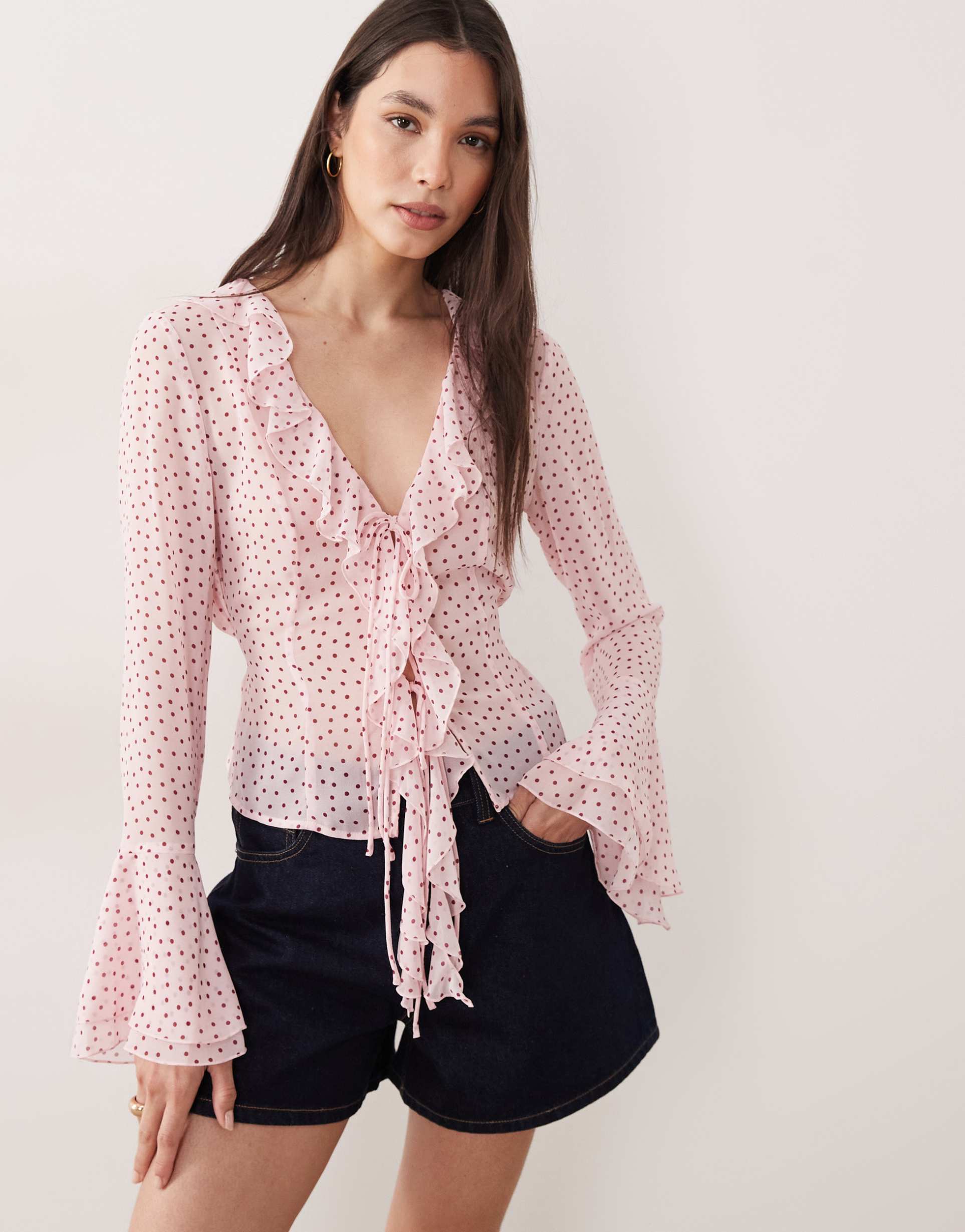 gina tricot v-neck ruffle blouse in pink polka dot print