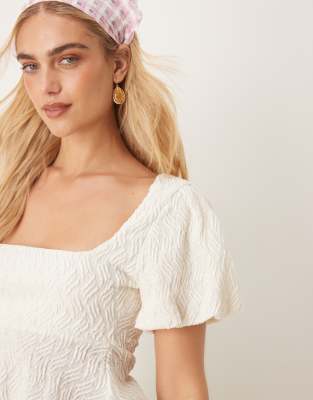 GINA TRICOT WAVY TEXTURED JERSEY WITH PUFF SLEEVES AND PEPLUM HEM 