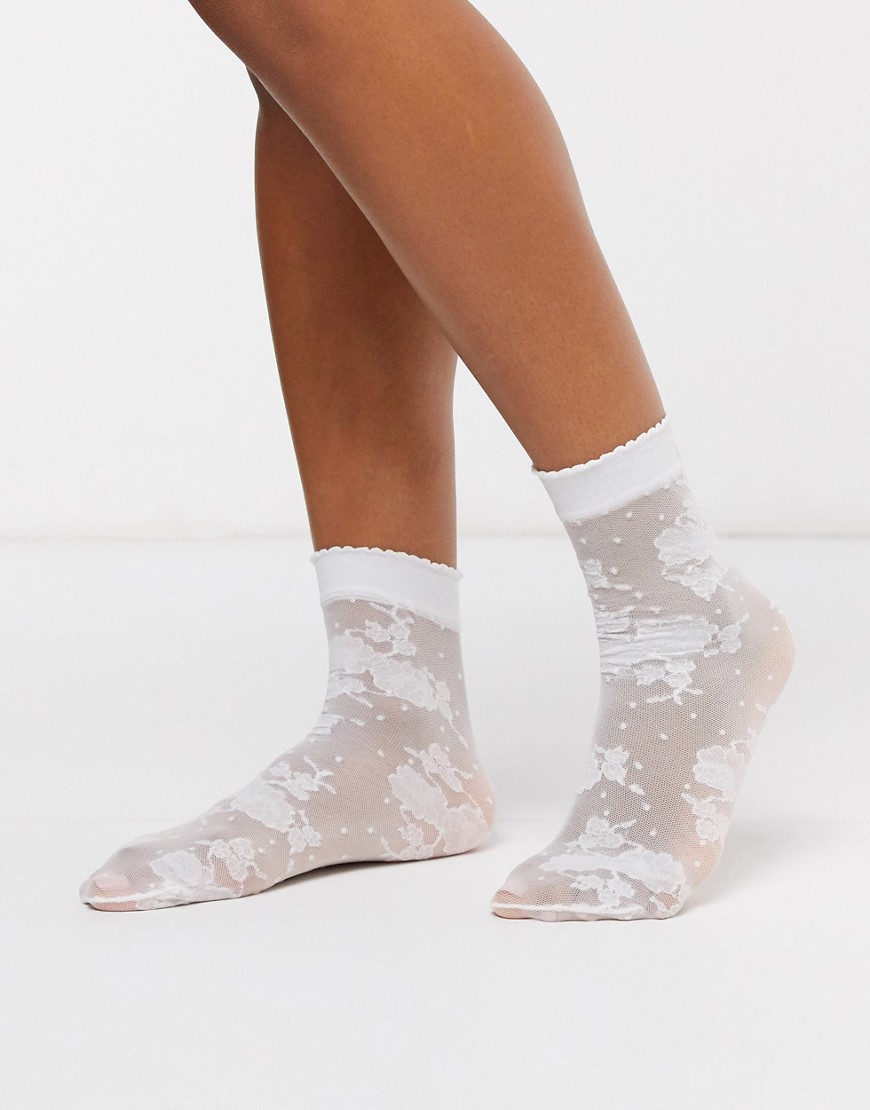 Gipsy - Doorschijnende sokken met stippen en bloemen in wit