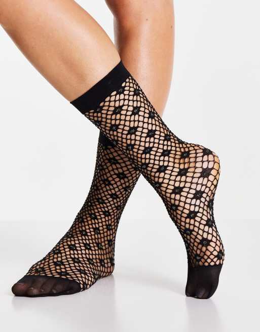 Gipsy sparkle glitter fishnet sock in black ASOS