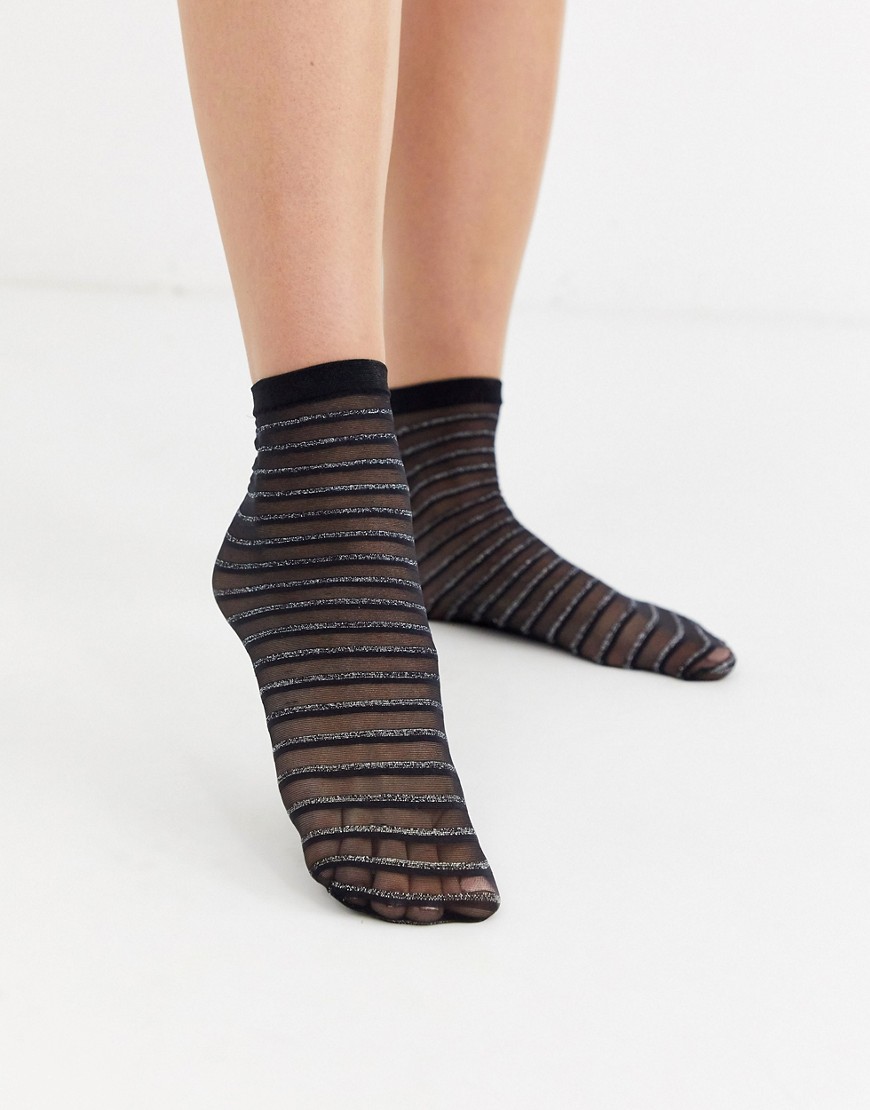 Gipsy – Svarta och silverfärgade strumpor i skir mesh med glittrig rand