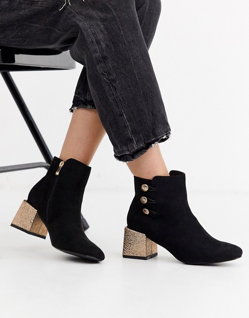 Glamorous ankle boots with metallic heel and button detail
