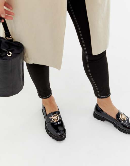 Glamorous black chunky flat shoes with gold sales lion trim