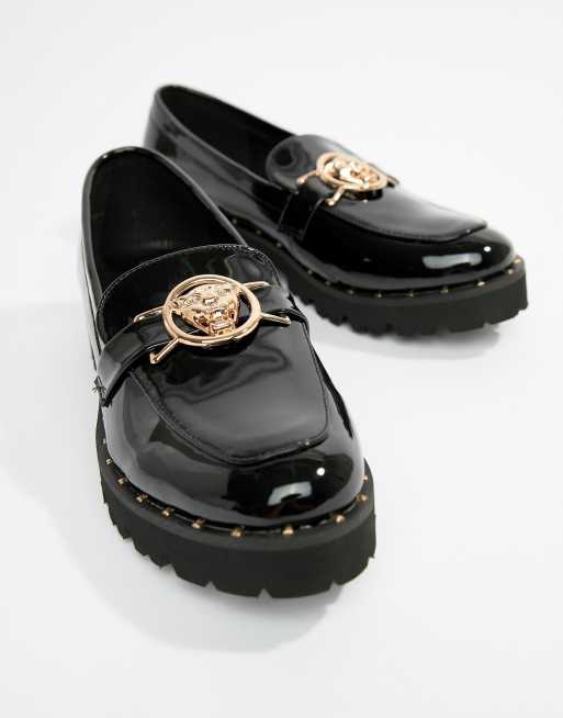 Glamorous black chunky flat shoes with gold sales lion trim