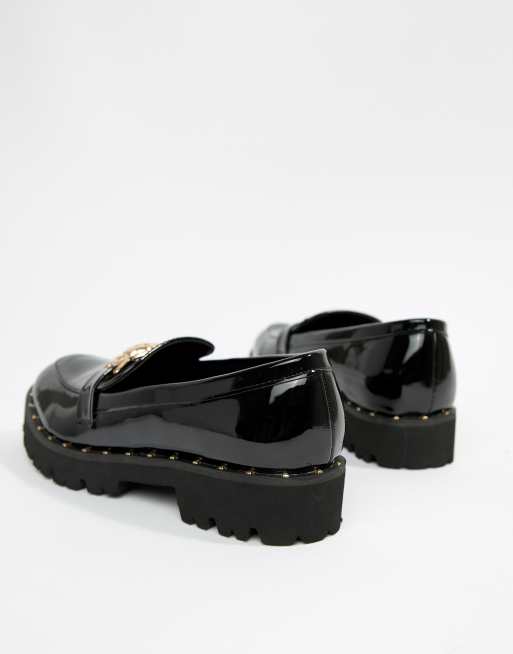 Glamorous black chunky flat shoes with gold sales lion trim