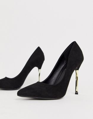 black heels with gold heel
