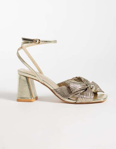 Glamorous block heeled sandals with bow in gold - view 1