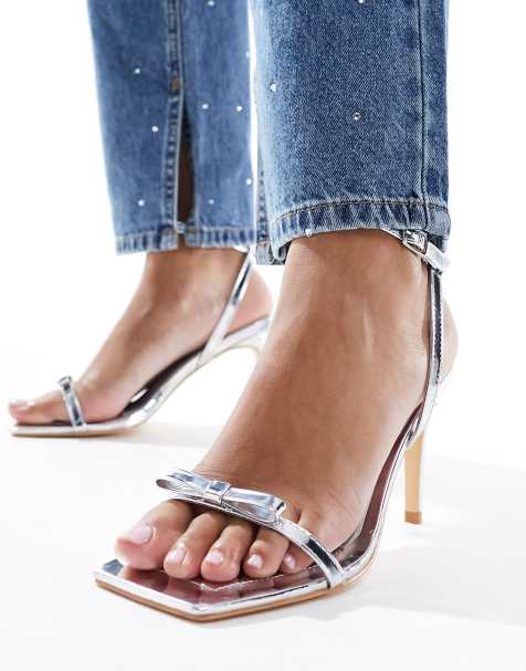 Glamorous bow barely there heeled sandals in silver - view 1