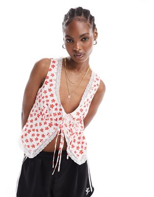 Glamorous corset detail tie front top with lace trim in red daisy print
