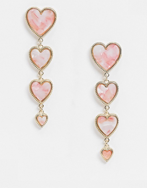 Glamorous drop earrings with resin heart in pink