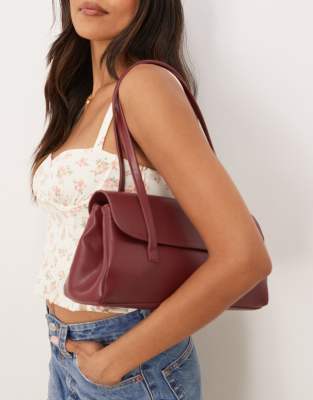 Glamorous elongated clean shoulder bag in burgundy - view 1