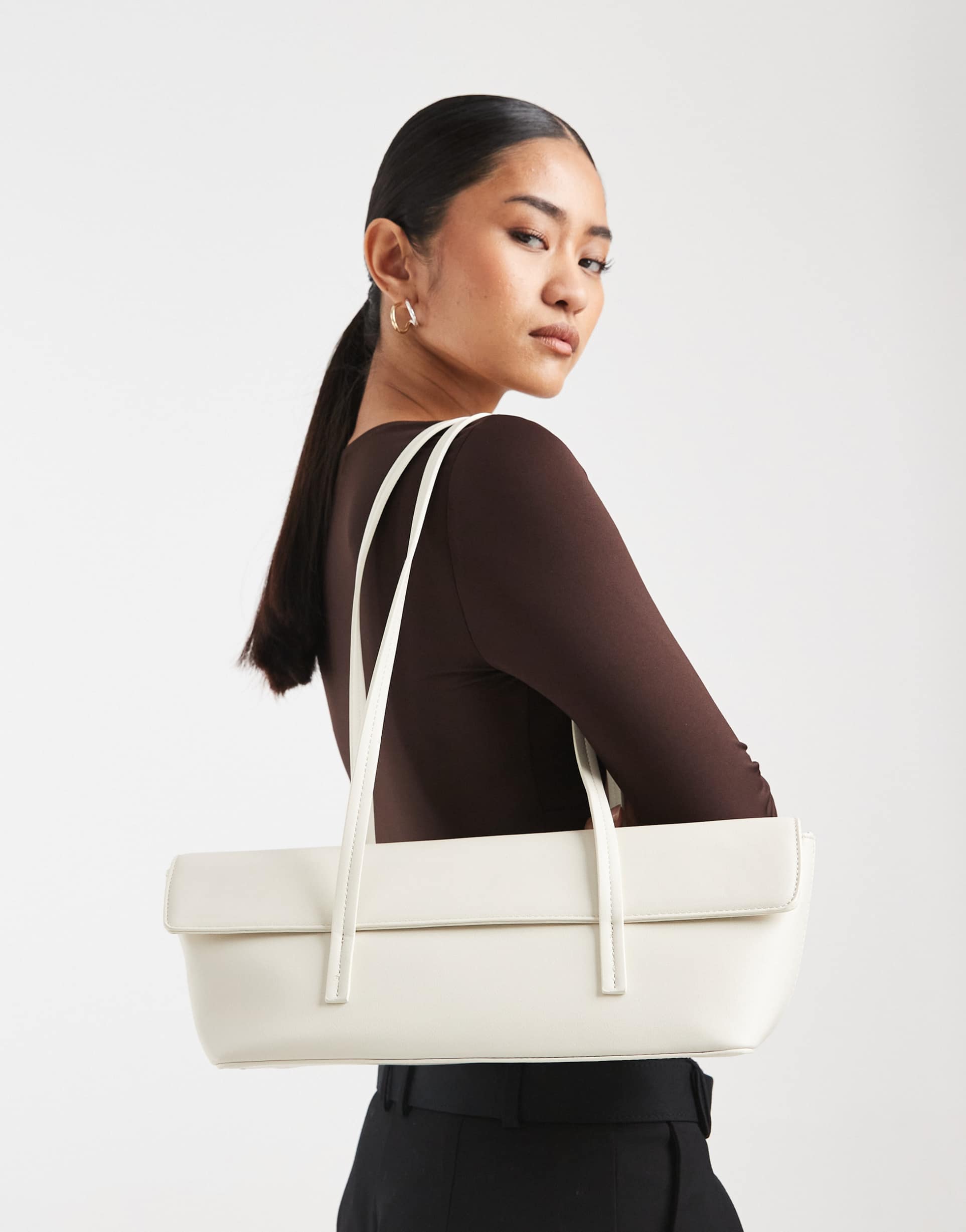 glamorous elongated shoulder bag in cream