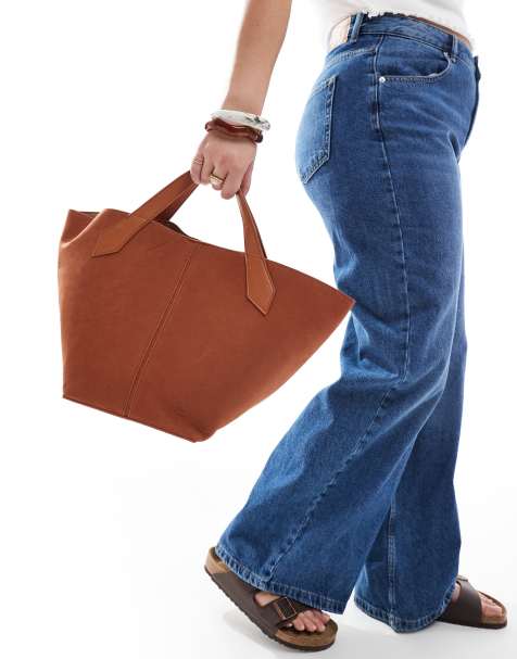 Glamorous faux suede top handle bag with crossbody strap in brown - view 1