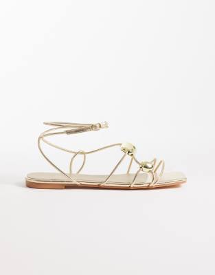 Glamorous Flat Sandals With Molten Detailing In Gold