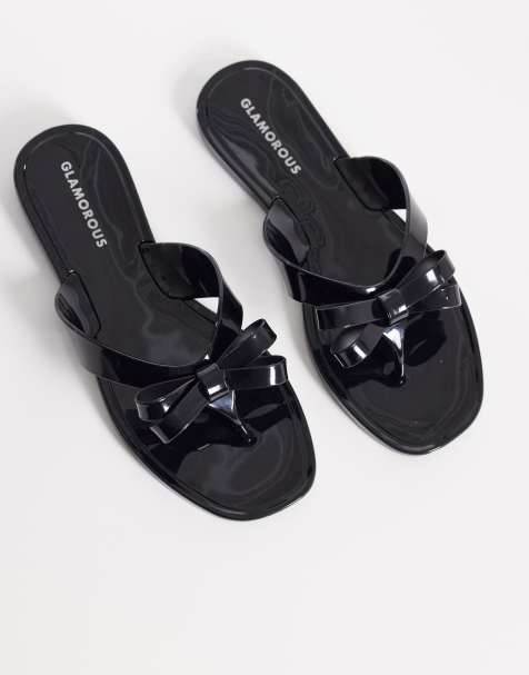 Glamorous jelly flip flops with bow detailing in black - view 1