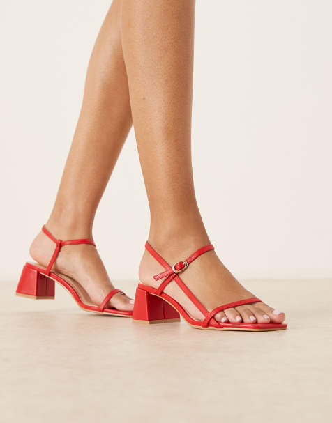 Glamorous low block heeled sandals in red - view 1