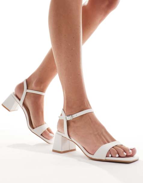 Glamorous low block heeled sandals in white - view 1