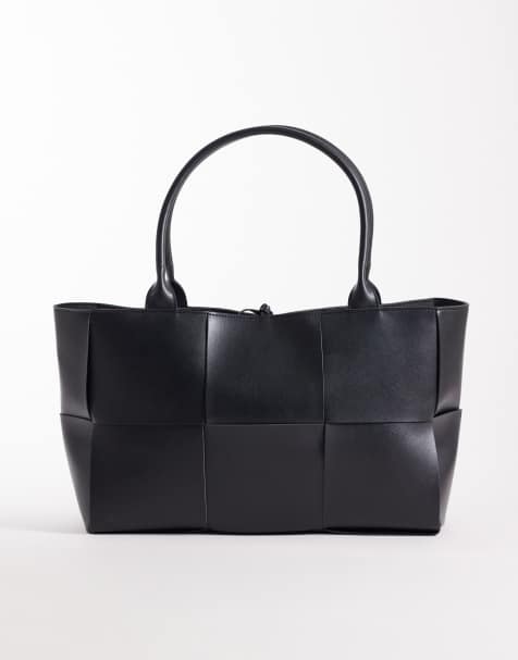 Glamorous oversized woven tote bag in black - view 1
