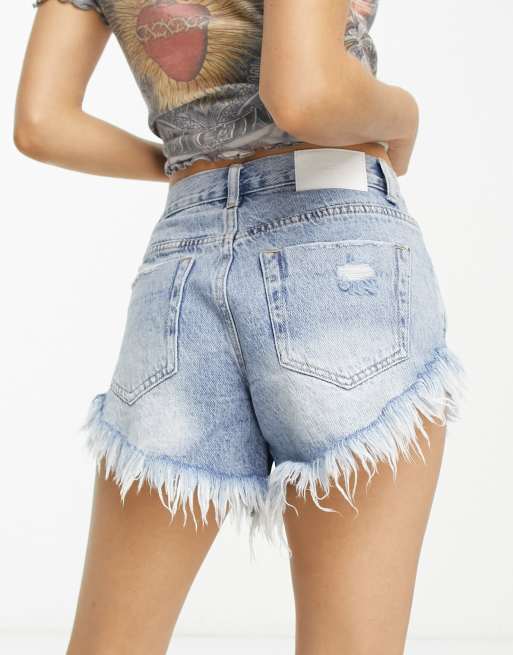 Glamorous Petite high waisted denim shorts with distressing in blue