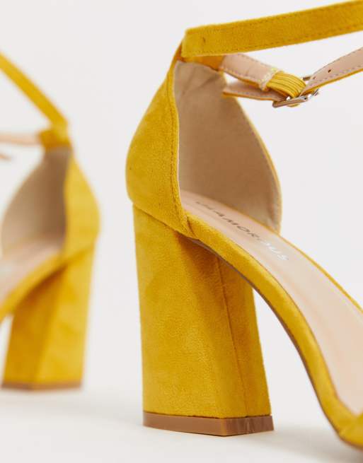 Glamorous pointed heeled shoes in bright yellow