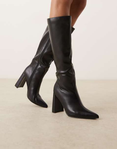 Glamorous pointed knee boots in black - view 1
