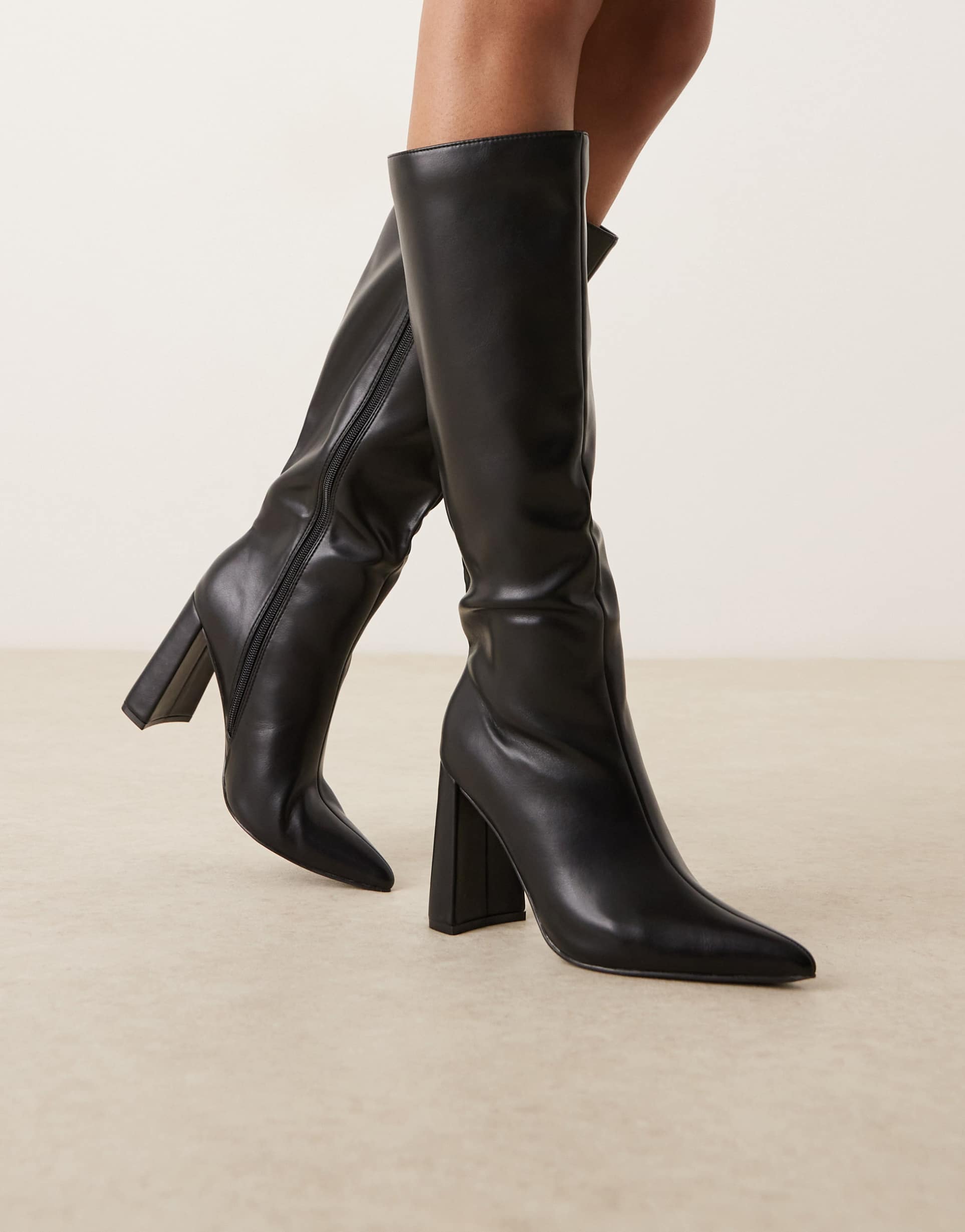 glamorous pointed knee boots in black