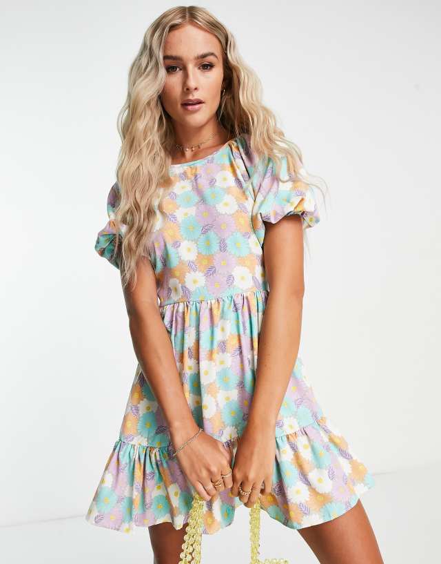 Glamorous puff sleeve tie back tiered mini dress in pastel daisy print