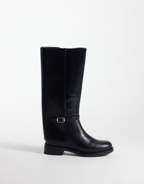 Glamorous riding knee boots with buckle in black - view 1