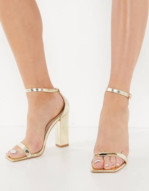 Glamorous sandals with block heels in gold mirror