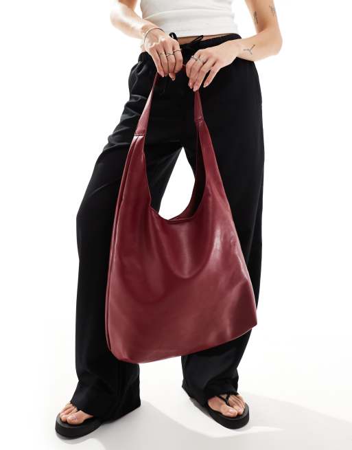 Glamorous shoulder tote bag in burgundy patent