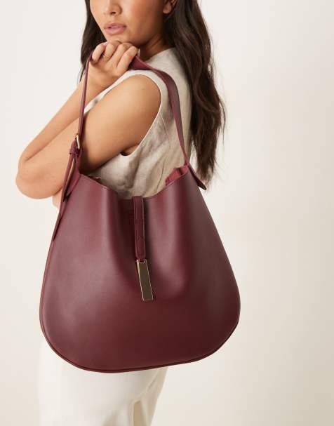 Glamorous slouchy shoulder bag with clasp detail in burgundy - view 1