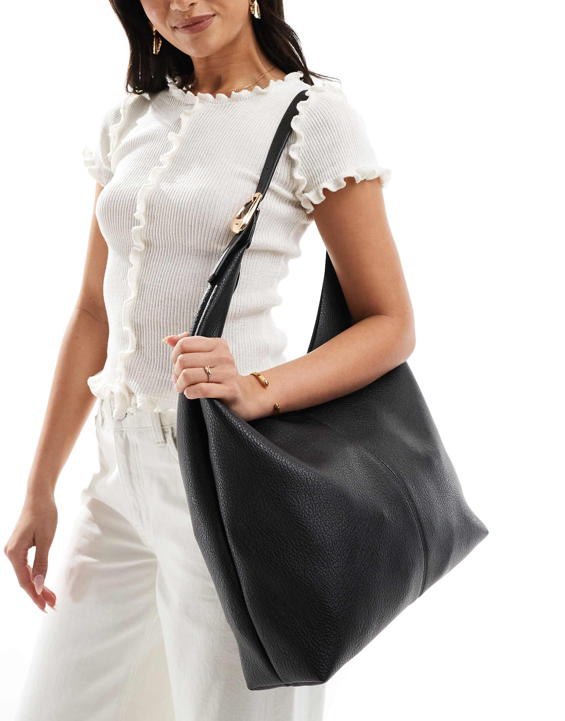 glamorous slouchy shoulder tote bag with molten buckle detail in black