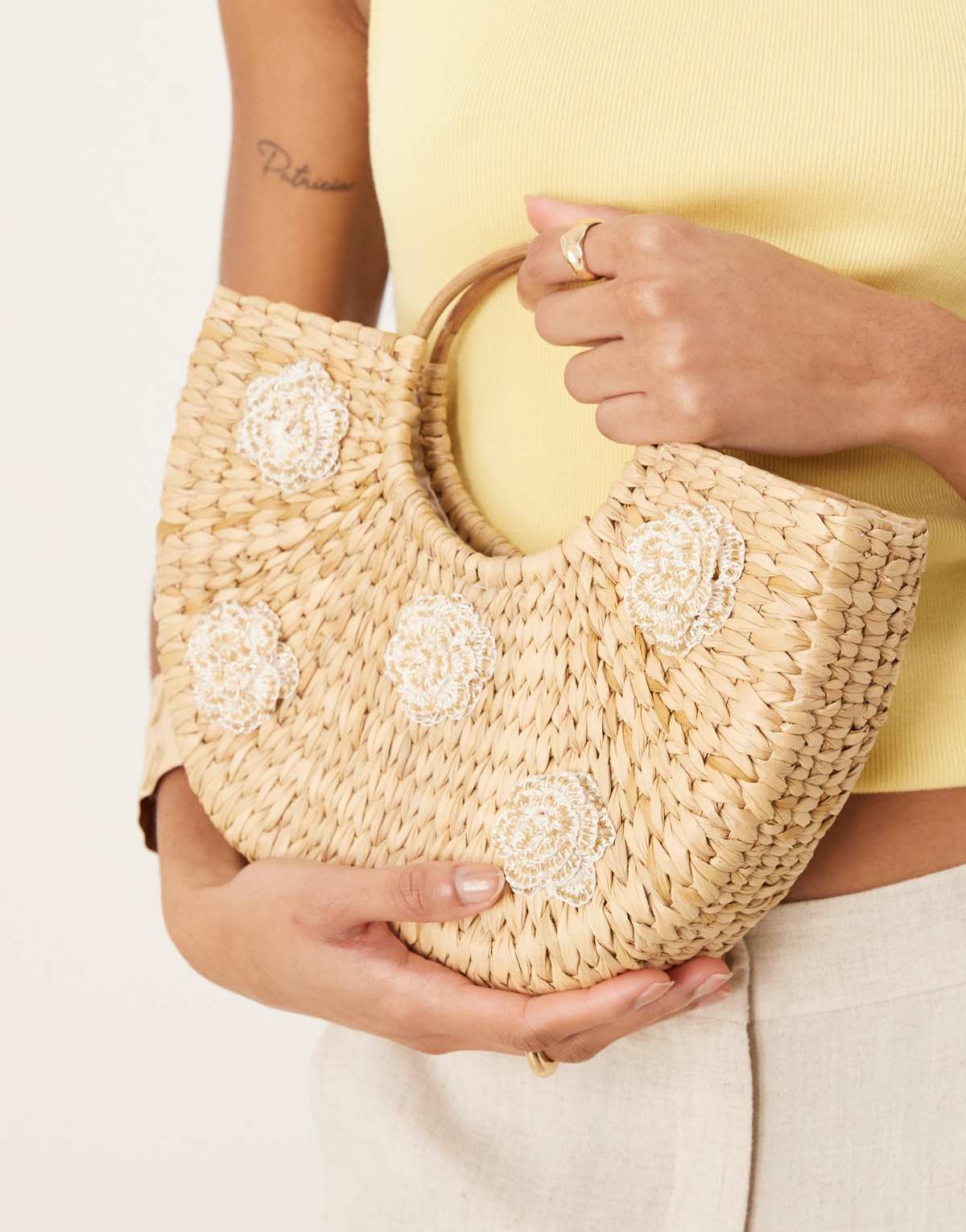 Glamorous straw top handle bag with flower embellishment in natural