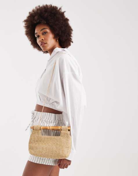 Glamorous structured raffia purse with faux bamboo handle in neutral - view 1
