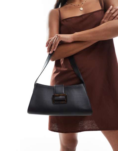 Glamorous tortoiseshell buckle shoulder bag in black - view 1