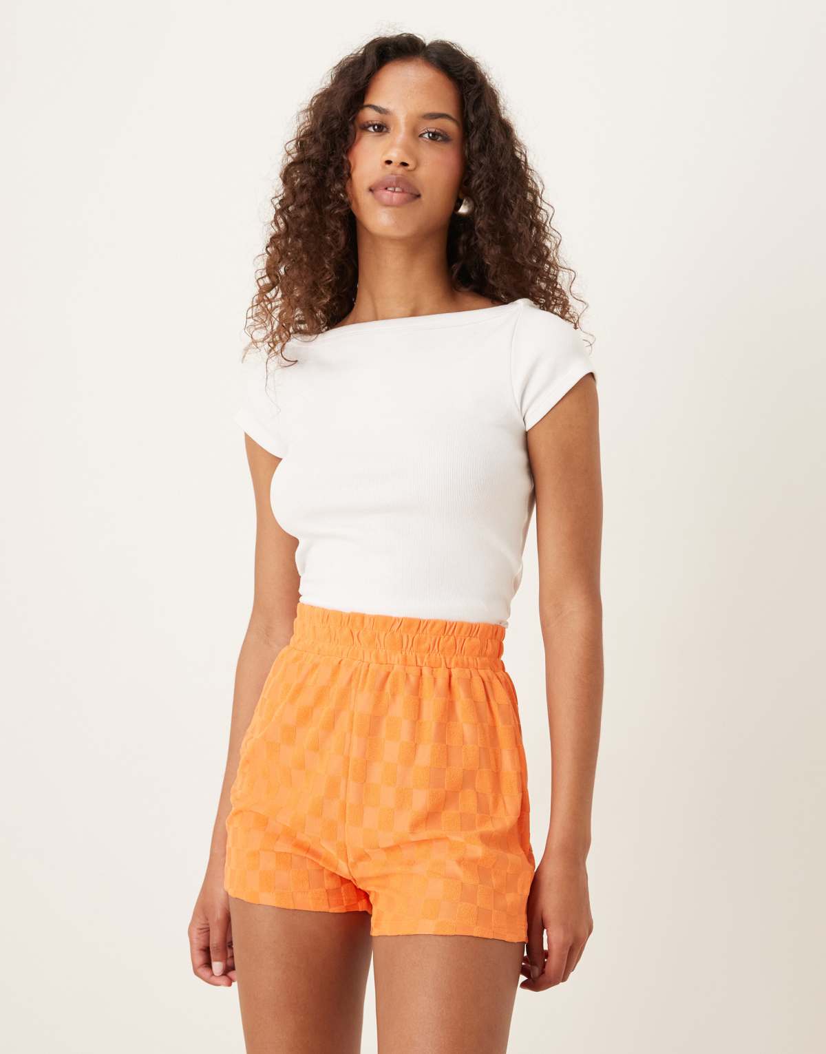 Glamorous Track shorts with back patch pocket in orange checkerboard