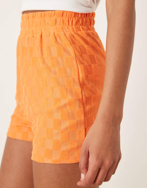 Glamorous Track shorts with back patch pocket in orange checkerboard, 3 of 5