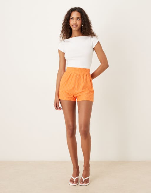 Glamorous Track shorts with back patch pocket in orange checkerboard, 4 of 5